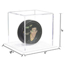 Clear hockey puck display case with synthetic white base for sports memorabilia