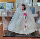 Clear acrylic display case designed to showcase a bride doll