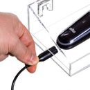 Clear acrylic wall-mounted shelf with charging cable openings