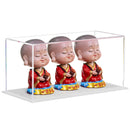 Clear acrylic display case with white base for collectibles